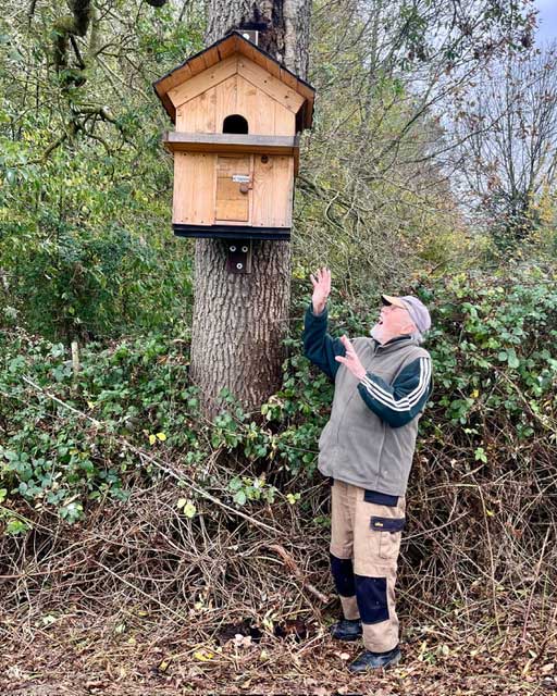 Howard beneath heavy box